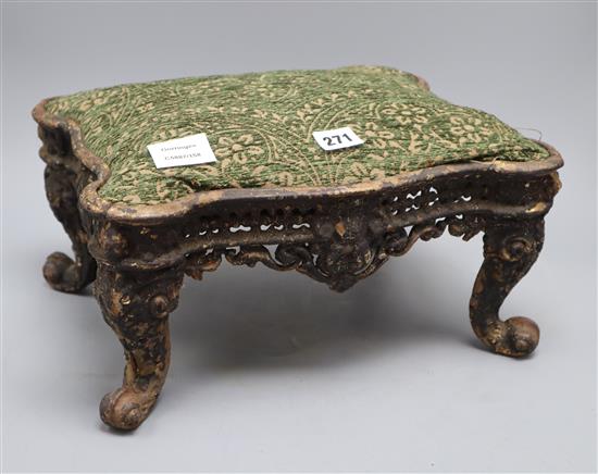 An American cast iron footstool